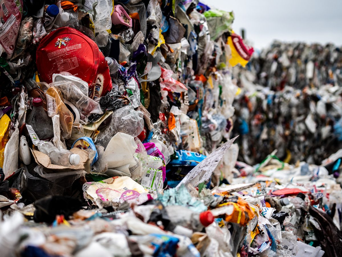 Bales of post-consumer plastic packaging awaiting recycling